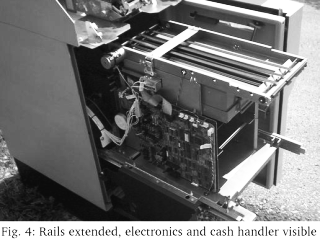 Fig. 4: Rails extended, electronics and cash handler visible